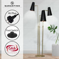 Sarantino three-arm floor lamp in room with callouts for AU Plug, Foot Switch, and SAA Approvals badge