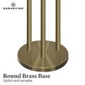 Sarantino close-up of brushed brass round base with three poles, text 