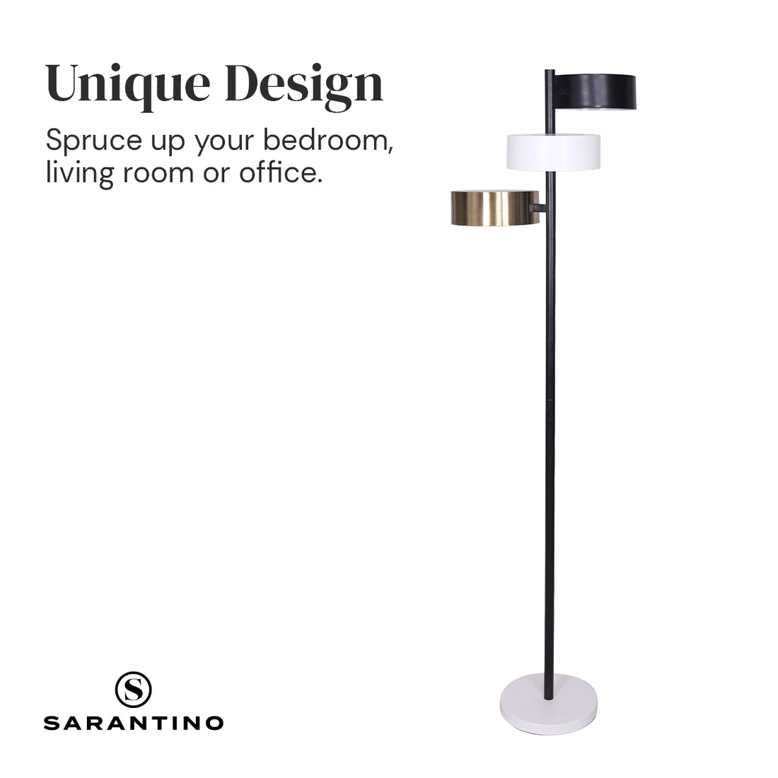 Three-arm floor lamp with black, white, and brass drum shades on black pole with white round base, white background