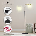 Dual-arm LED floor lamp lit in beige room with AU plug, floor switch and SAA Approvals callouts, Sarantino logo