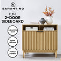 Sarantino Eleni 2-door sideboard feature image, text: Adjustable Shelf, Open Niches, Fluted Panels, styled with vases on top