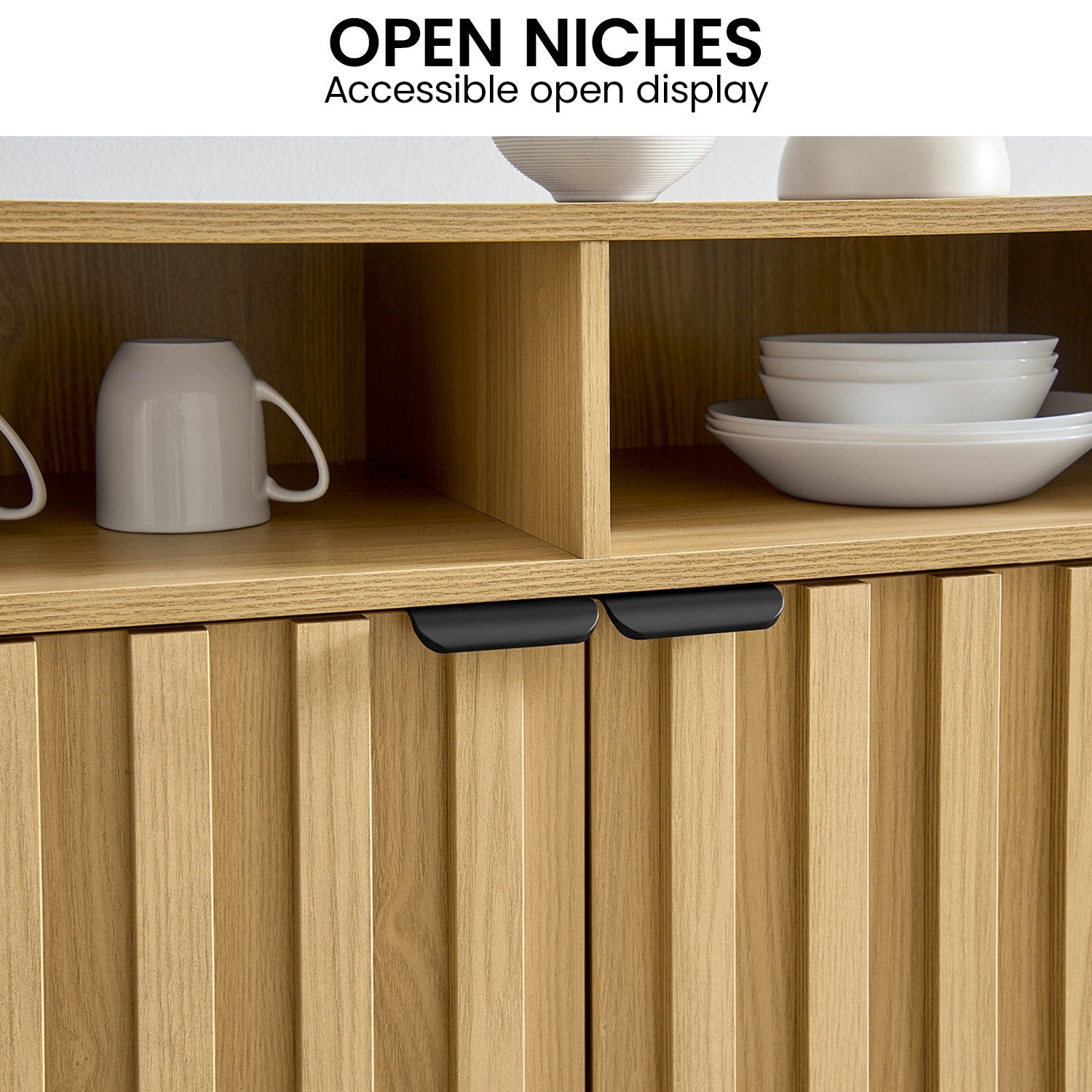 Close-up of Sarantino Eleni sideboard open niches with mug and plates, fluted doors below, text: Open Niches