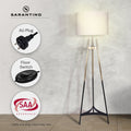 Sarantino tripod floor lamp lit in room with callouts for AU Plug, Floor Switch, and SAA Approvals badge