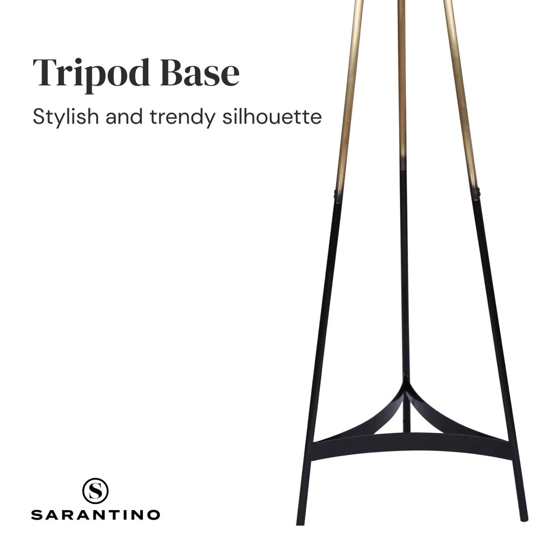 Tripod floor lamp with three black and gold legs and large white cylindrical drum shade on white background