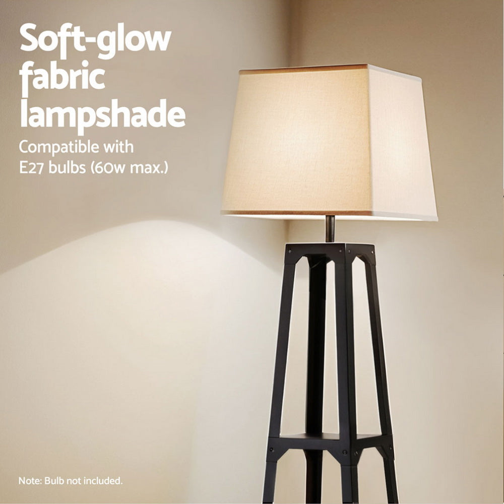 Close-up of tapered black shelf floor lamp with beige fabric shade glowing, text overlay E27 60w max compatible