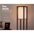Close-up of brown fabric shelf floor lamp shade glowing warm with E27 60W max bulb spec and feature text overlay