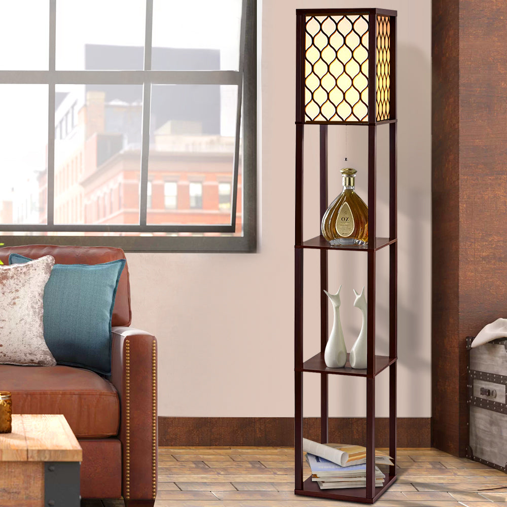 Brown lattice shelf floor lamp in living room with leather sofa, three shelves holding decorative bottle and white vases