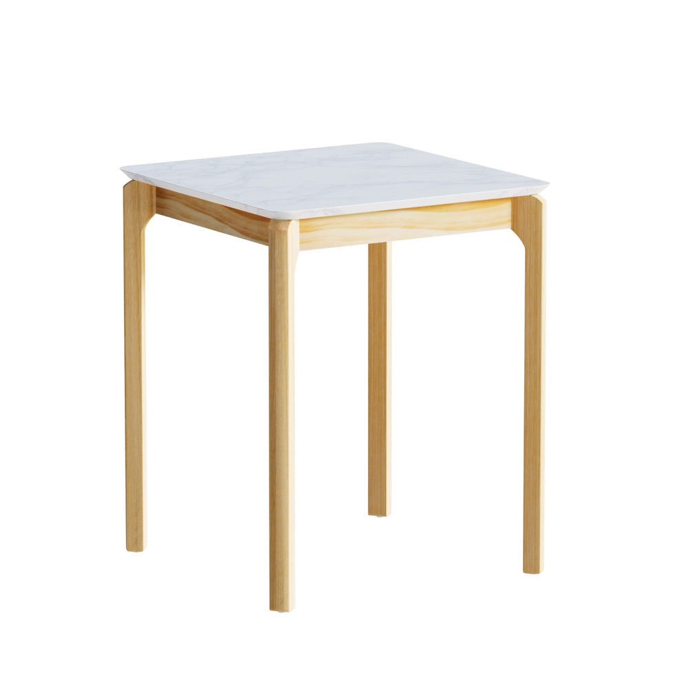 Square side table with white marble-effect top and natural pine wood legs, three-quarter angle on white background