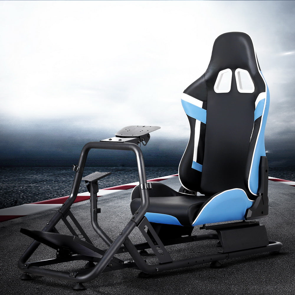 Sim racing cockpit with blue black white bucket seat on stormy race track lifestyle background, angle view
