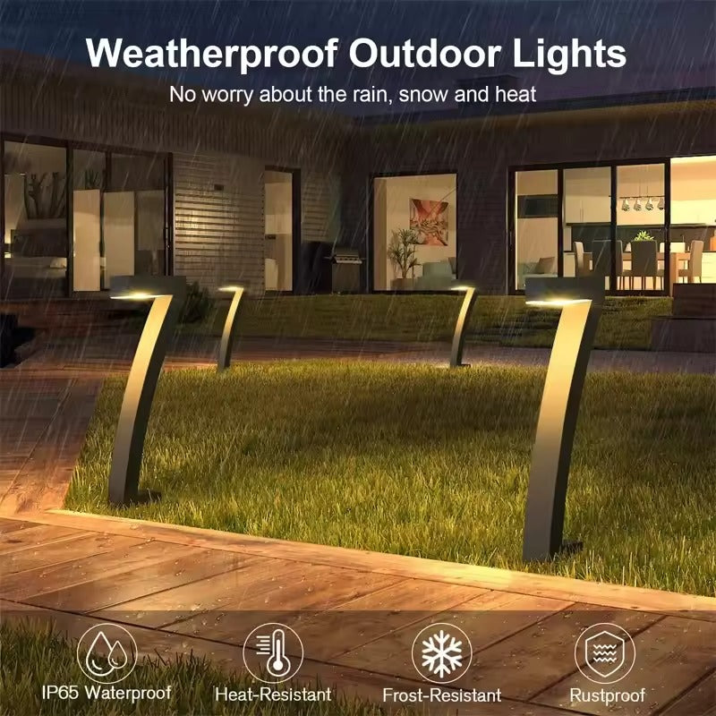 Three angled solar path lights glowing on lawn in rain with house behind, Weatherproof IP65 waterproof frost resistant icons