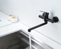 Side angle view of black stainless steel basin faucet with extended lever