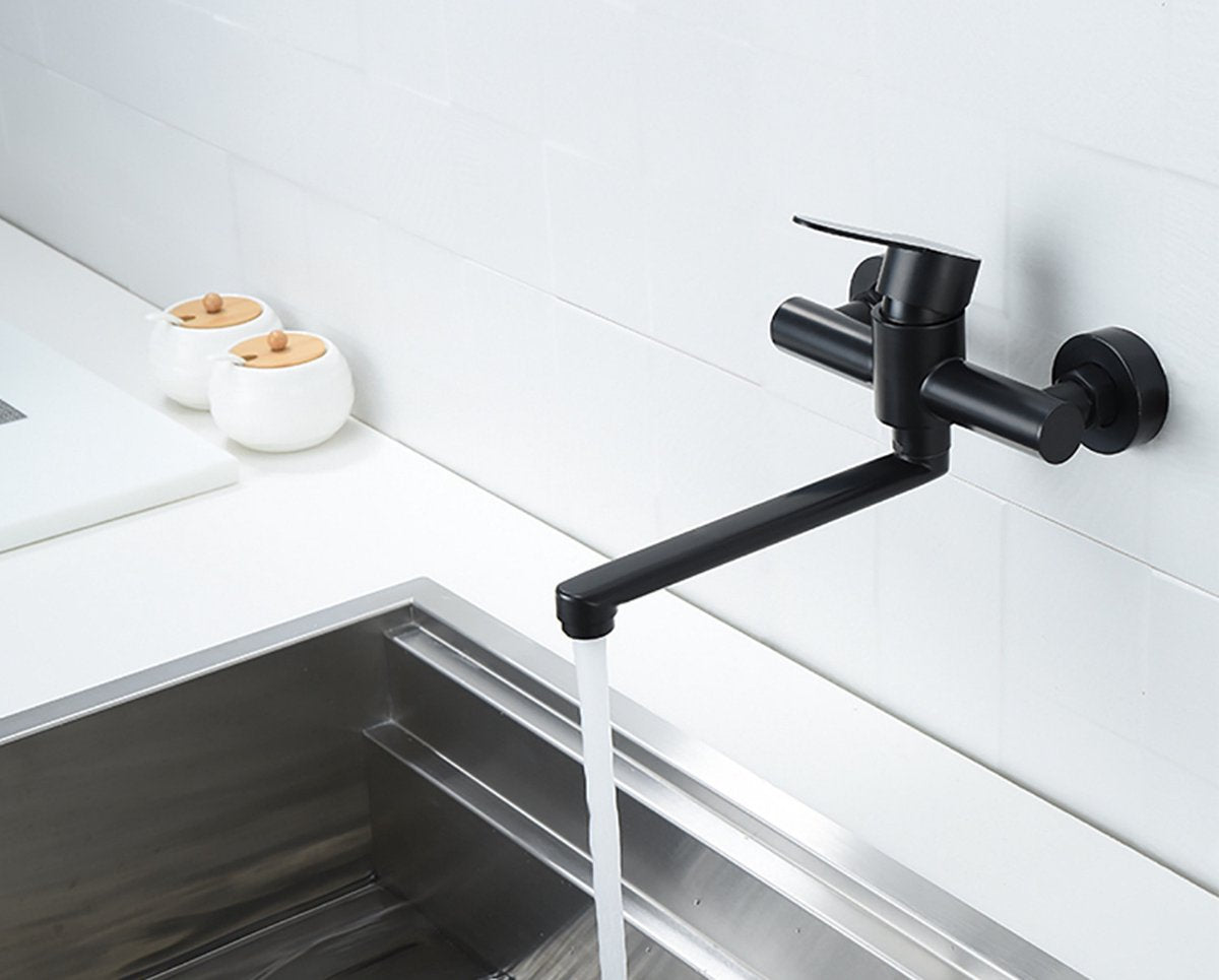 Side angle view of black stainless steel basin faucet with extended lever