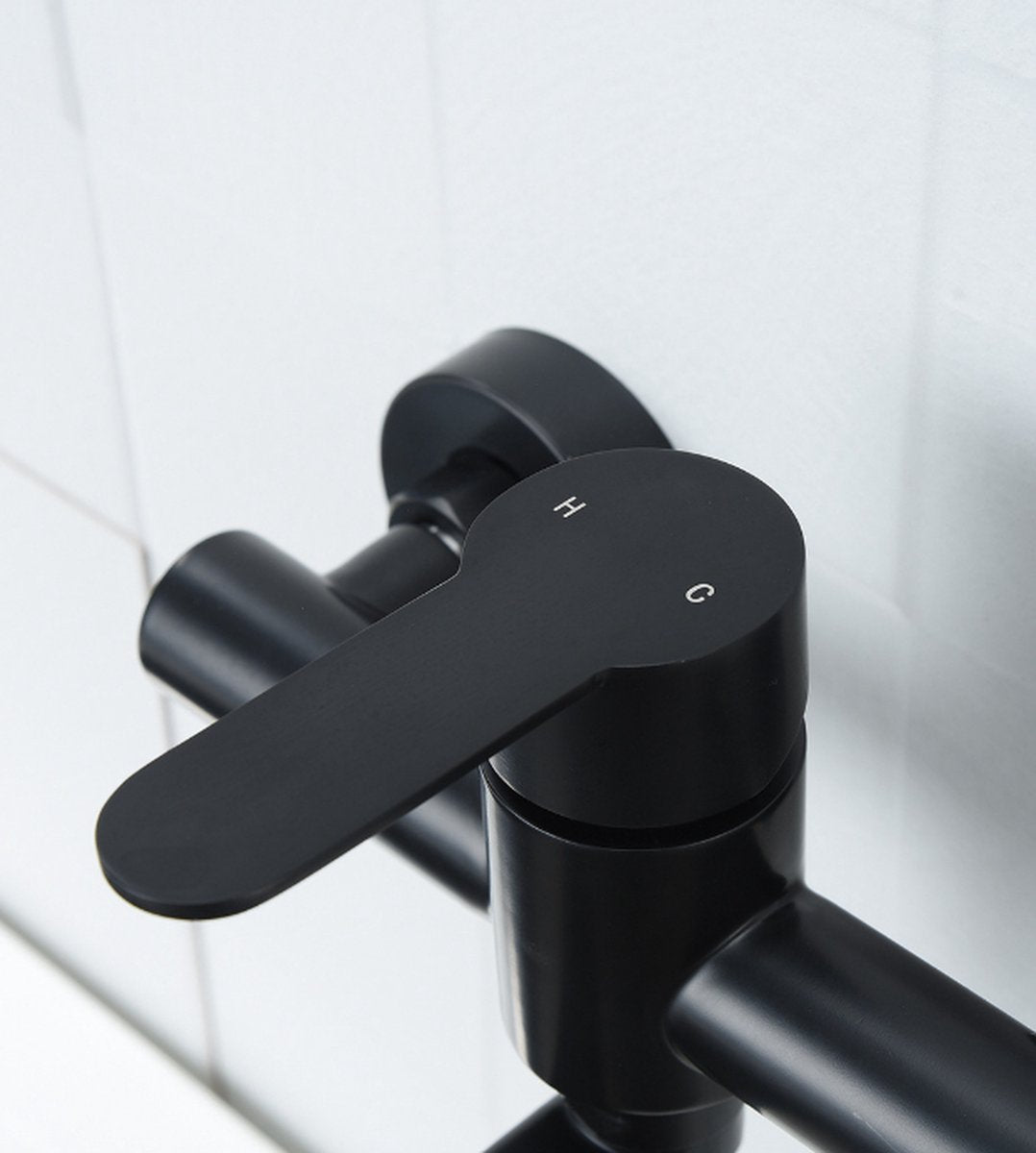 Black stainless steel basin faucet detail showing water outlet and mechanism