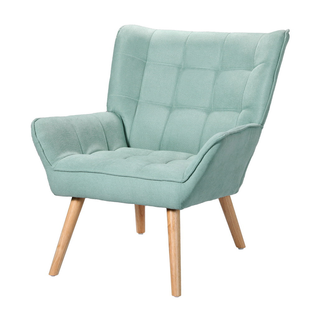 Teal green fabric armchair with grid-tufted back and seat, winged backrest, and natural wood tapered legs, angle view