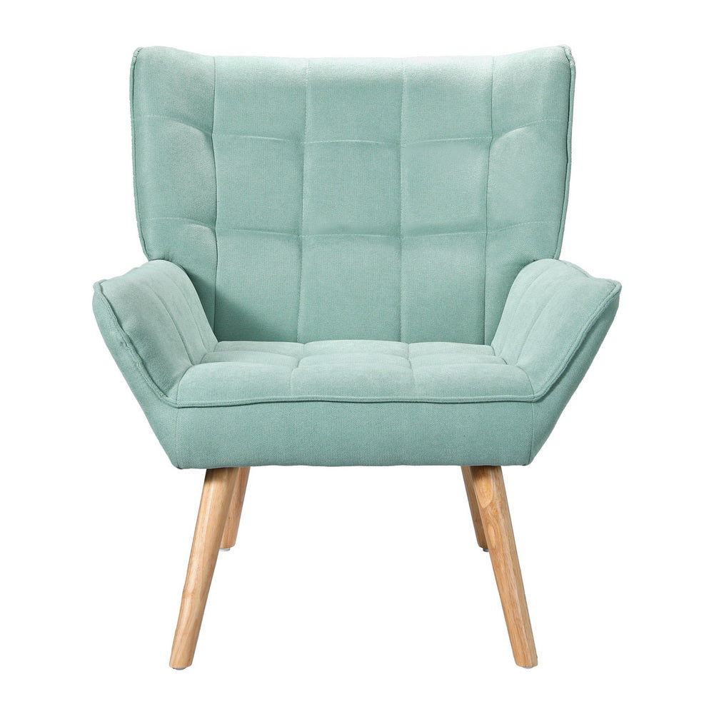 Teal green grid-tufted fabric armchair with winged back and natural wood tapered legs, front view on white background