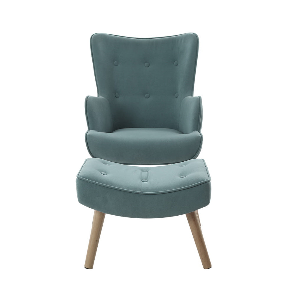 Teal velvet wingback armchair with six button-tufted backrest and matching footstool, direct front view on white background