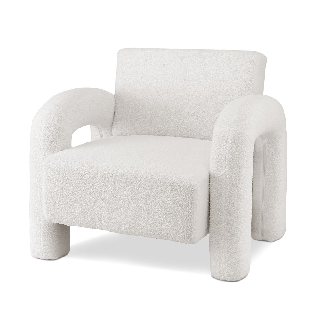 White teddy fabric armchair with arched arms and cylindrical legs in bright room with plants and black dome lamp