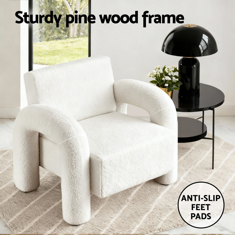 White teddy armchair in room setting with callouts: "Sturdy pine wood frame" and "Anti-slip feet pads" badge