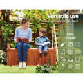 Woman and child seated on timber storage bench in garden reading; text: Versatile use, 300kg capacity, ideal storage icons