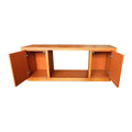 Walnut TV console front view with both cabinet doors open showing orange interior compartments and central open bay