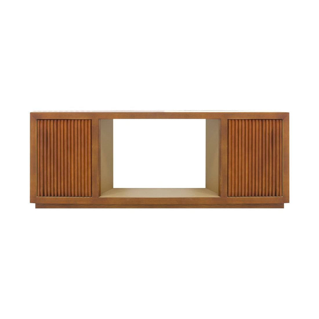 Walnut TV console with two reeded doors flanking open central bay in living room, vase, art and lamp on top, sofa beside