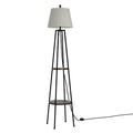 Black tripod floor lamp with two round walnut shelves and grey fabric drum shade on white background, front view
