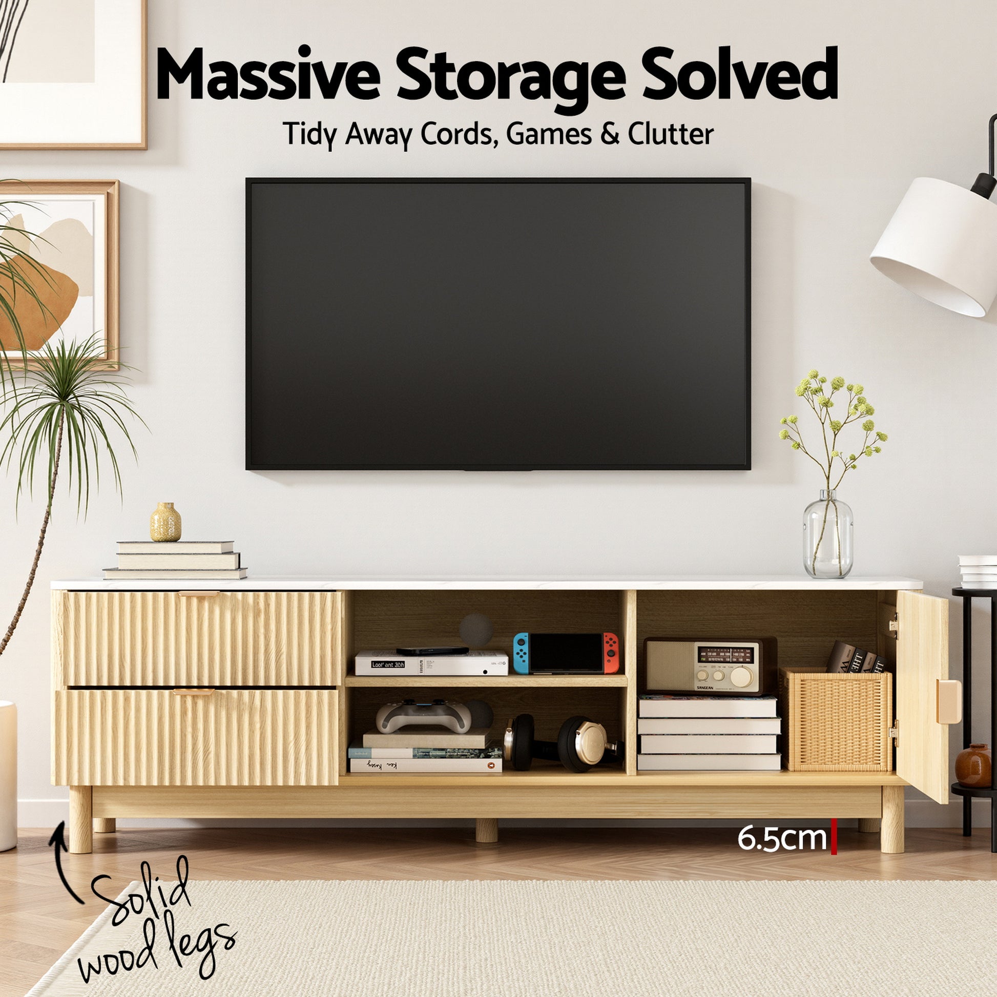 Natural wood TV unit styled with games, headphones and books in shelves, text: Massive Storage Solved, Solid wood legs