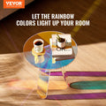 Vevor iridescent acrylic round side table on timber floor casting rainbow light projections, with a coffee cup, books and