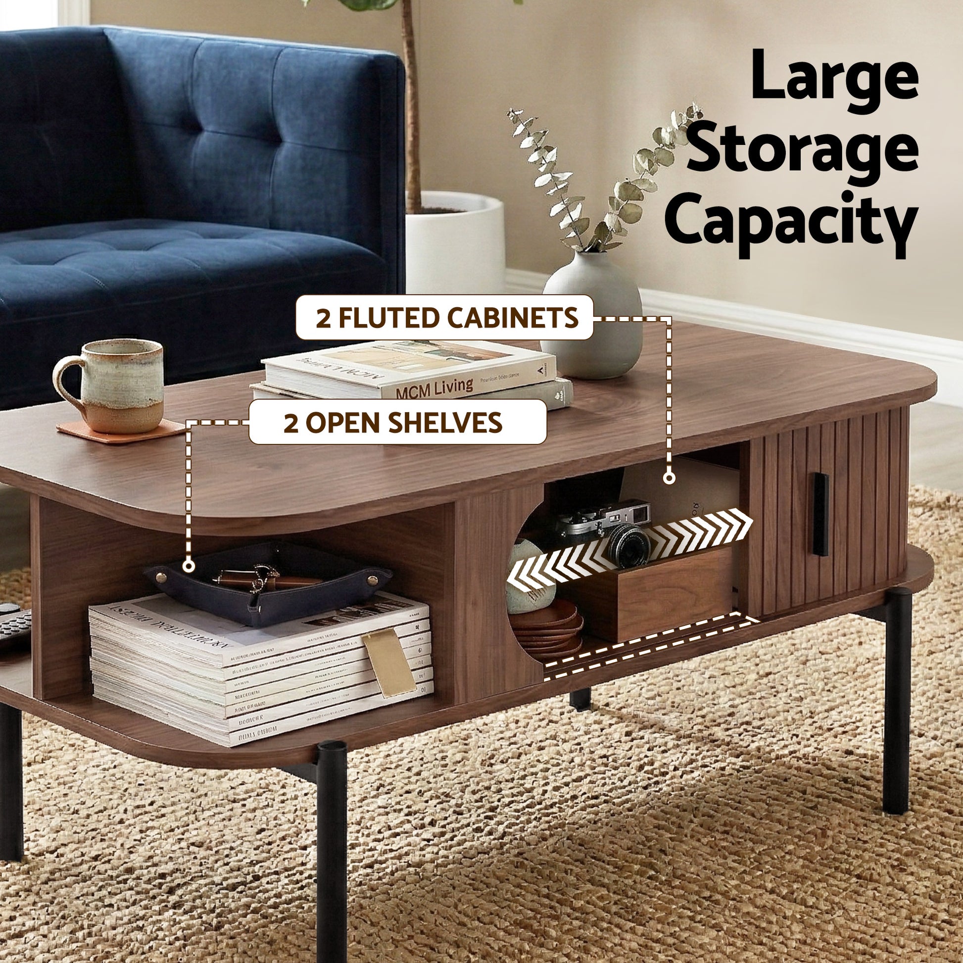 Walnut coffee table with books in open shelves beside blue sofa, text: Large Storage Capacity, 2 Fluted Cabinets
