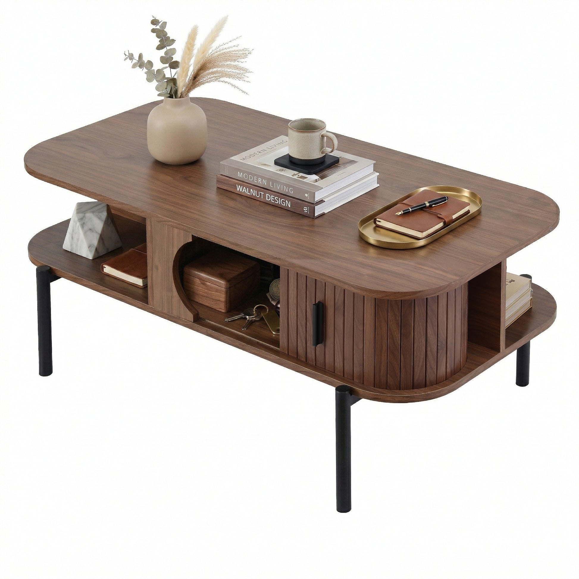 Walnut coffee table angle view with books and decor on top, open side shelves with keys and box, fluted sliding door