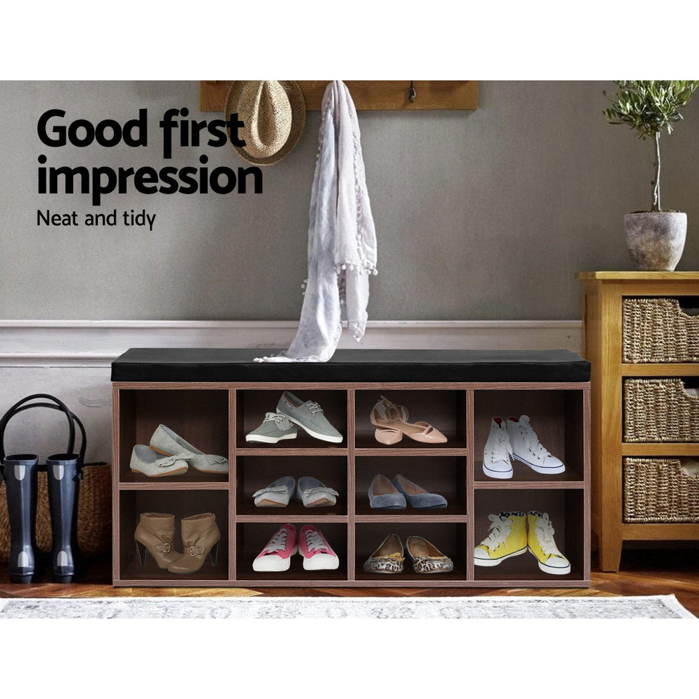Walnut 10-cube shoe bench in hallway with wall hooks and scarf nearby cubbies loaded with various shoes