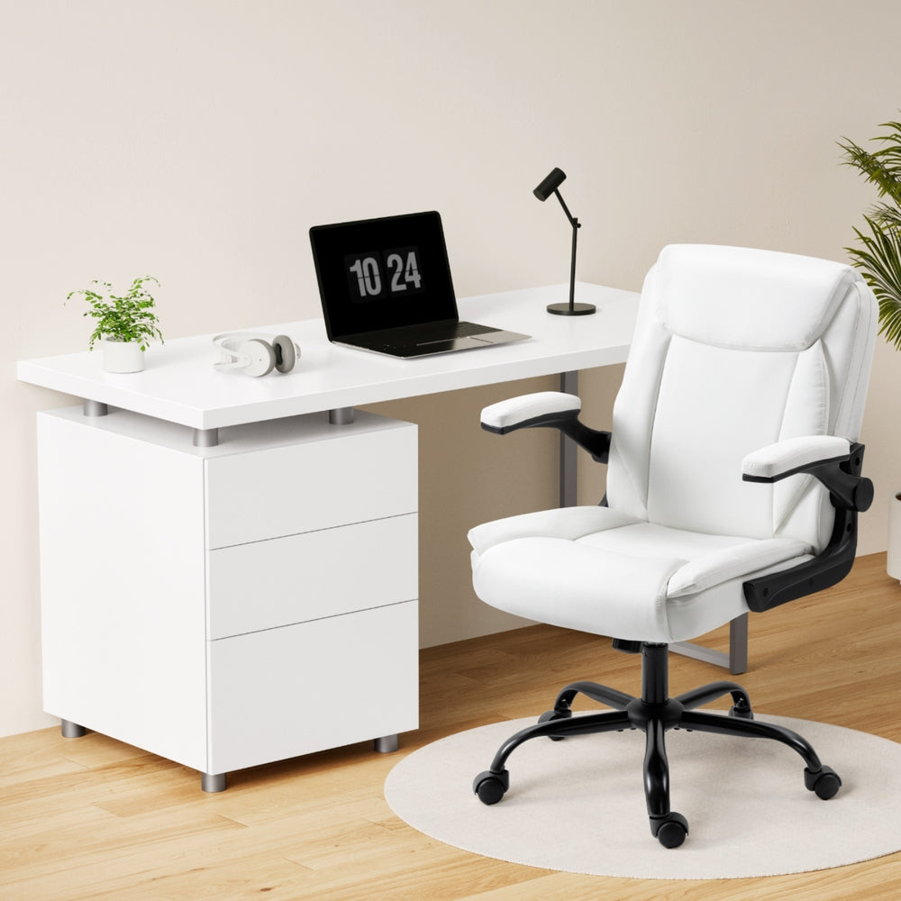 White 140cm office desk and white chair lifestyle setting with laptop lamp and headphones
