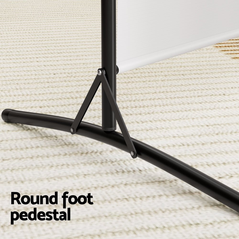 White 3-panel fabric room divider round foot pedestal close-up on cream rug with black T-bar base and triangular brace