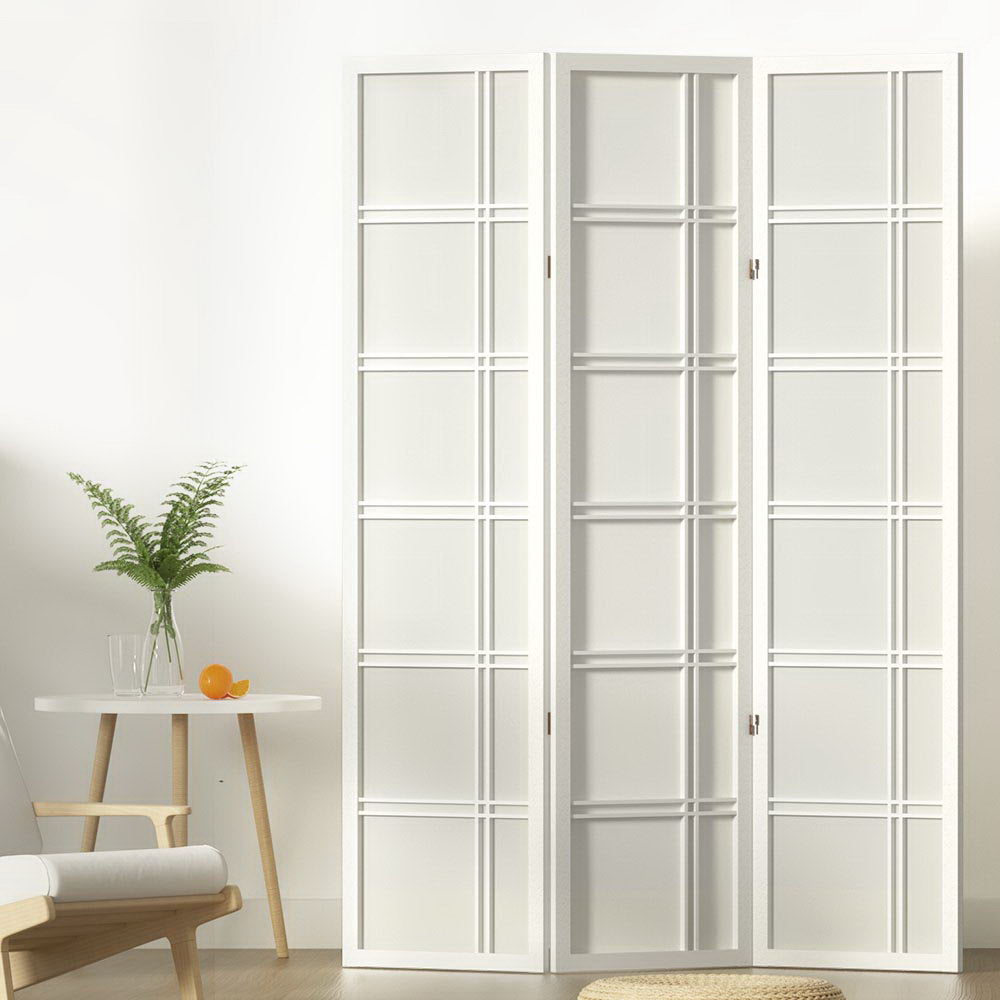 White 3-panel double crosshatch shoji room divider in lifestyle room with fern plant orange on round side table