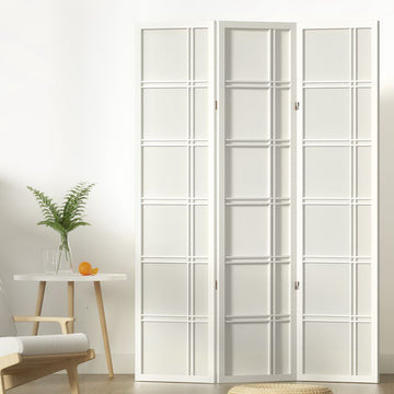 White 3-panel double crosshatch shoji room divider in lifestyle room with fern plant orange on round side table