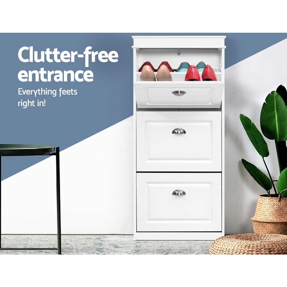 White three-tier shoe cabinet top open with coloured shoes two lower doors closed clutter-free entrance text in hallway