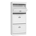 White three-tier shoe cabinet three-quarter angle top flip-out door open showing empty tray two lower cup handle doors closed