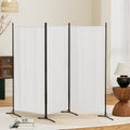 White 4-panel fabric room divider in living room lifestyle with woven pendant blossoming branch and lamp on sideboard
