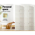 White 4-panel double crosshatch shoji room divider in bedroom lifestyle with pine bed and two-way gold metal hinges callout