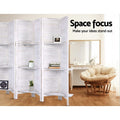 White 4-panel louvered wood room divider with shelves in bedroom with papasan rattan chair and white dressing table