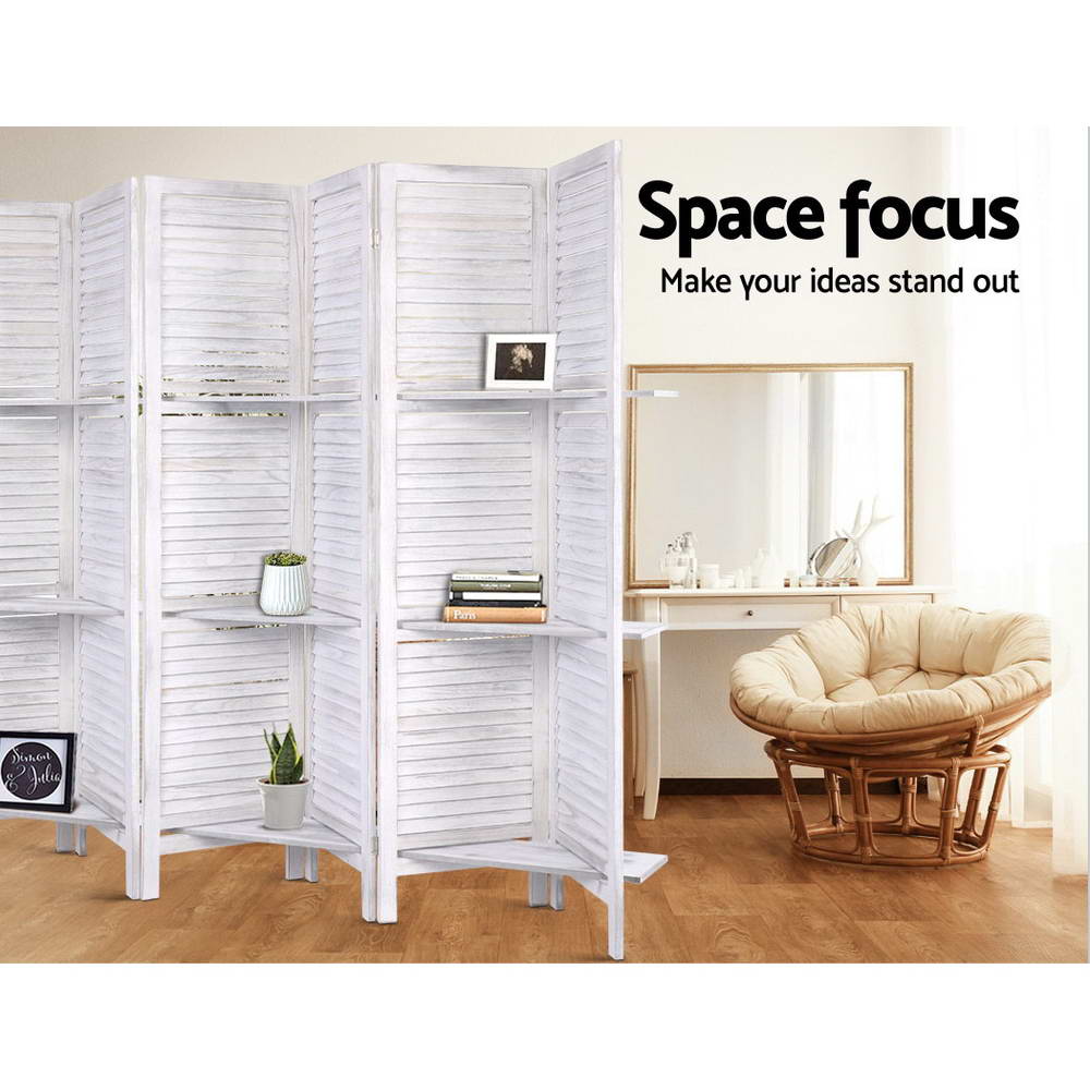 White 4-panel louvered wood room divider with shelves in bedroom with papasan rattan chair and white dressing table