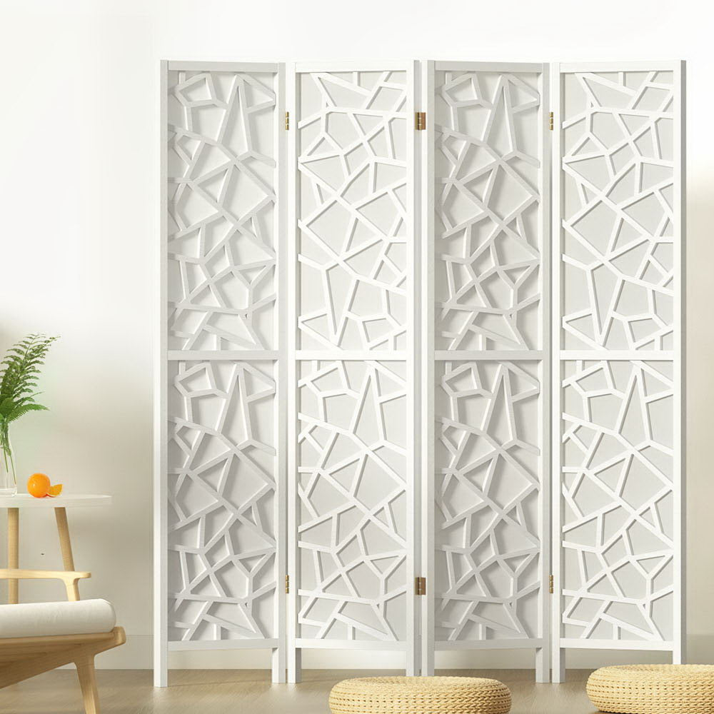 White 4-panel MDF star cutout room divider in lifestyle room with fern plant orange round table armchair and floor cushions