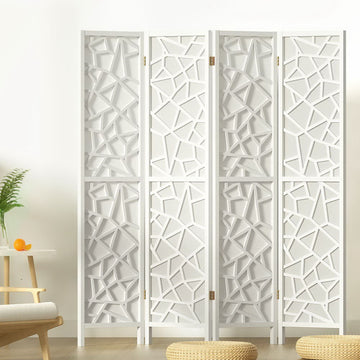 White 4-panel MDF star cutout room divider in lifestyle room with fern plant orange round table armchair and floor cushions