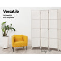 White 4-panel woven paper rope room divider in living room lifestyle with yellow armchair and ZZ plant against white wall