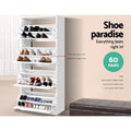 White four-tier shoe cabinet all flip-out trays open loaded with shoes shoe paradise 60 pairs badge middle panel note
