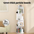 White rotating 5-tier bookshelf in living room with decor, text: 12mm thick particle boards, 5kg per shelf