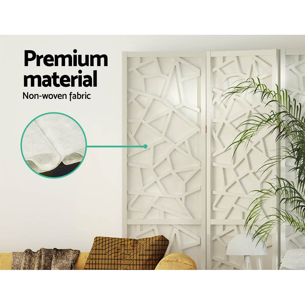White 6-panel geometric room divider non-woven fabric panel close-up in lifestyle room with palm plant and yellow sofa