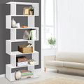 White 6-tier S-shaped display bookcase loaded with books, vases and baskets in living room with cream sofa