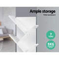Close-up of white tree bookcase diagonal shelves with text: 7 tiers, 5kg capacity per tier, wide backboard