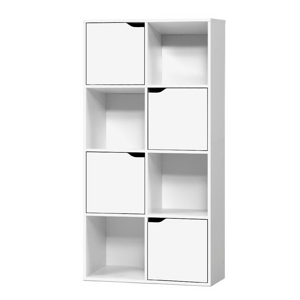 White 8-cube storage shelf in living room styled with stuffed rabbit, books and storage boxes against dark wall